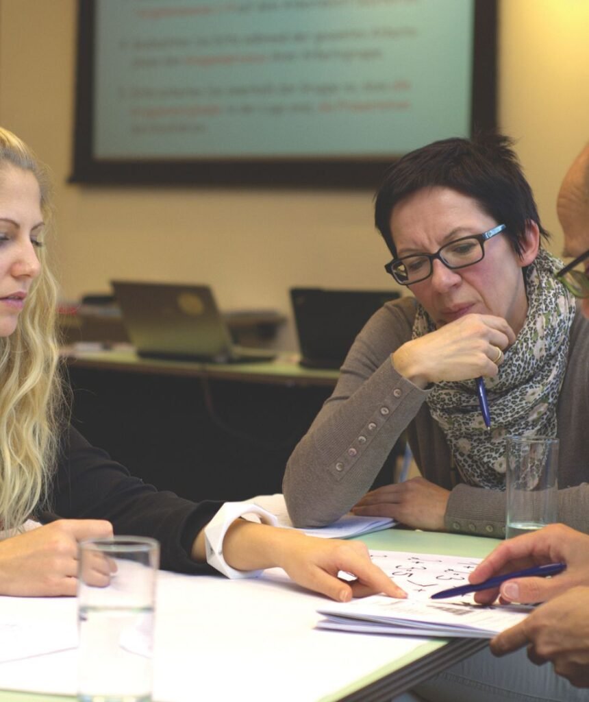 Employees discussing UAE gratuity law updated in a meeting